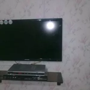 Навеска телевизоров шкафов полок в Караганде